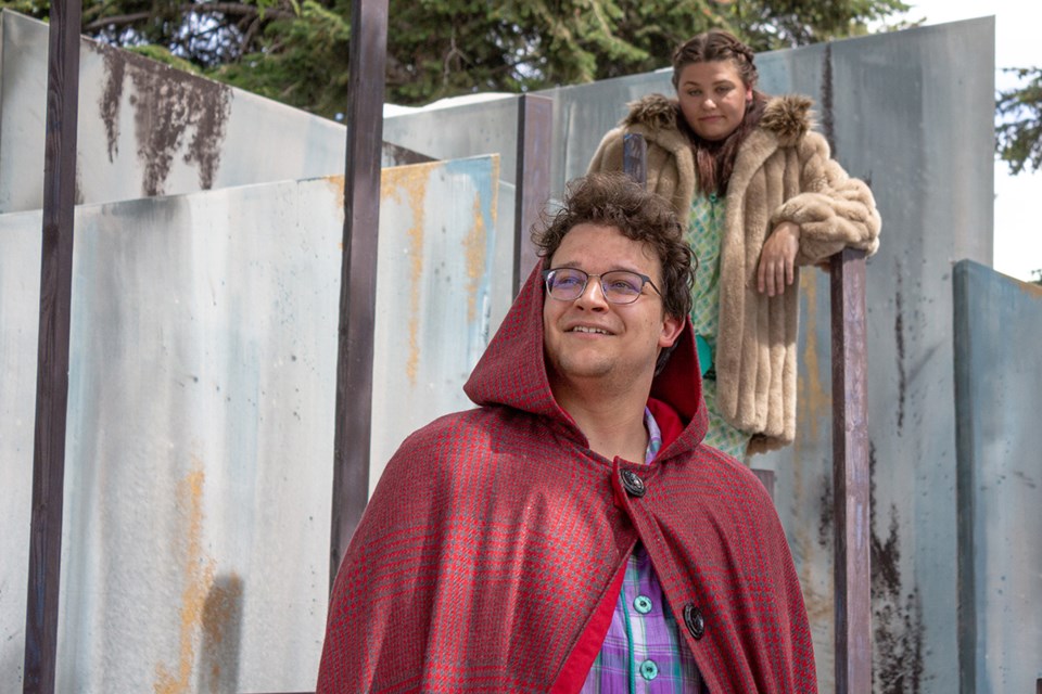 Brendan Law, who plays Little Red Riding Hood, is seen on stage during a dress rehearsal for Project X's Theatre in the Park, as the wolf (Brittney Martens) slyly looks on.