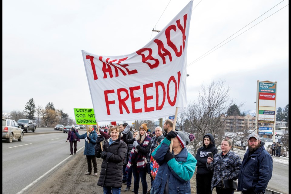 As trucks headed east through Valleyview on the Trans-Canada Highway at about noon, supporters of their cause — and opponents of vaccine mandates — lined the highway with signs and shouts of encouragement.
