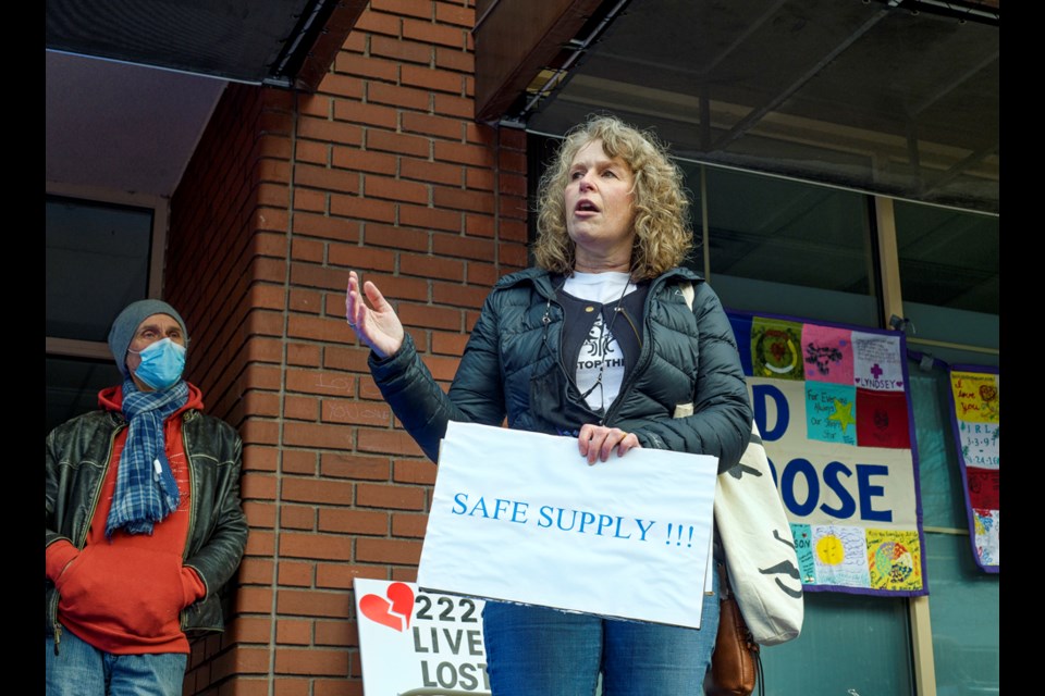 Sandra Tully speaks from her own experience as her son died from an overdose in 2016. Tully was among those who took part in Mom's Stop the Harm gathering on Thursday, Feb. 10, 2022, outside both MLA constituency offices.
