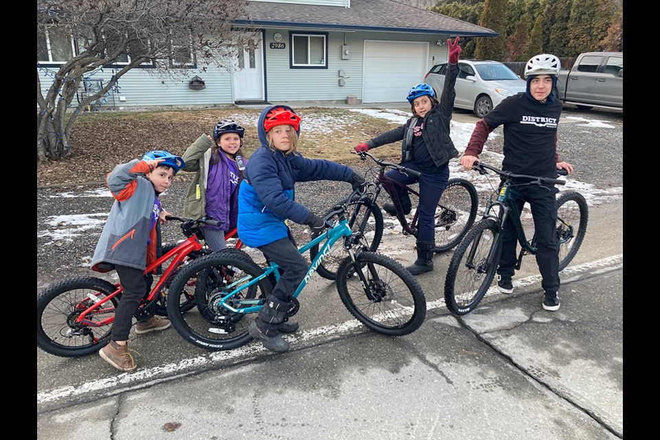 From left: The Paauwe siblings — Noah,6, Mystic, 8, Gabriel,11, Jacob,12 and Connor, 14 — with their new bikes and garb at their Westsyde home. Jacob’s bicycle was stolen from school on Feb. 22 and was replaced — along with a bike for each of his siblings — on March 2 thanks to pipeline workers who worked with the District Bicycle Company.