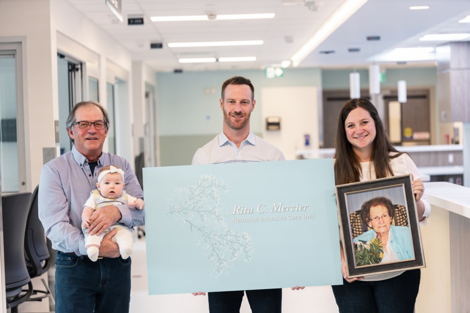 guy-mercier-with-granddaughter-briar-son-justin-and-daughter-aimee-holding-a-photo-of-her-grandmother-rita-c-mercier