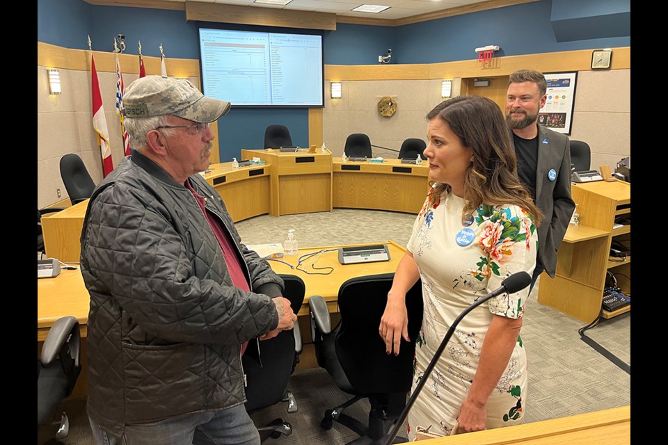 Katie Nuestaeter chats with fellow councillor candidate George Dersch on election night at city hall. Neustaeter topped the pools in her first foray into civic politics, while Dersch finished 20th.
