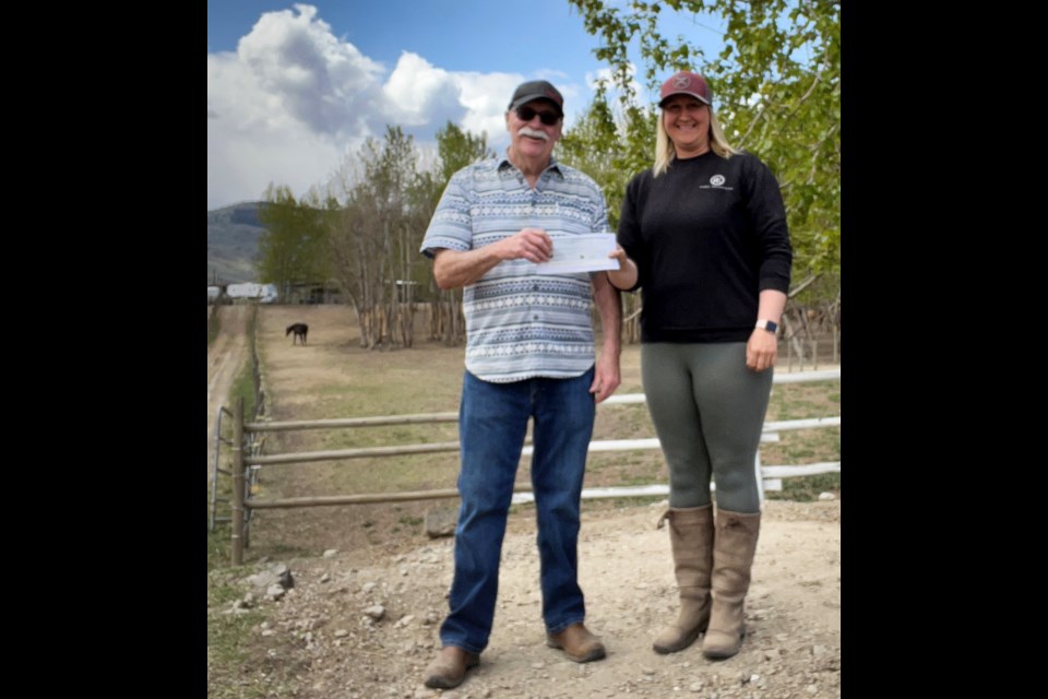 Kamloops Moose Lodge 1552 member Jack Buchanan (left) presents a cheque for $1,000 to  Kamloops Therapeutic Riding Association executive director Ashley Sudds.  The donation will help sponsor one of their therapeutic riding horses. Chevy, the Canadian/Morgan gelding is known for having an outgoing personality and a wild hairdo. Chevy has a great temperment and is a valuable member of the therapeutic riding program, aiding in weekly lessons for one of the riding associationâs para-dressage athletes efforts to train and qualify for Avery Wilkinson in the upcoming 2022 BC Summer Games in Prince George.