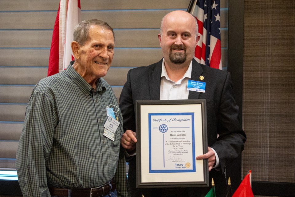 Longtime Kamloops Rotary Club member Russ Gerard (left) is presented with a certificate of recognition as a member in good standing for 50 years by District 5060 assistant governor Devon O’Toole. Sean Brady/KTW
