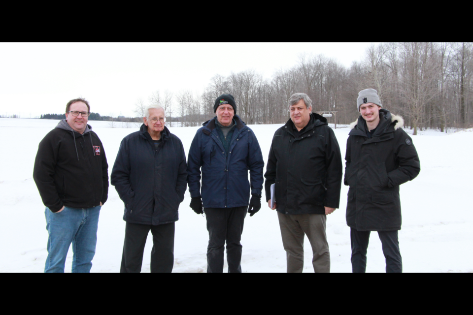 At the future site of the rec. centre. (From left to right) Chris Martin, Campaign Chair -- Bill Gies, Donor -- Joe Nowak, Mayor -- Jim Gies (Bill's son) -- Reagan Gies (Bill's Grandson)