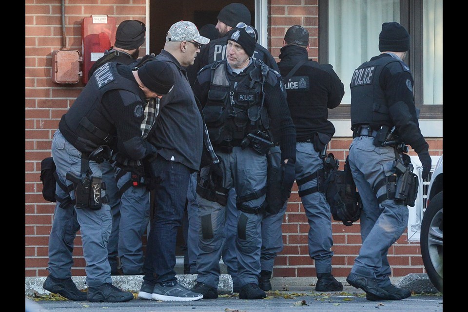 Police take a man into custody outside the Parkview Motel Monday morning after a six hour standoff. Tony Saxon/GuelphToday