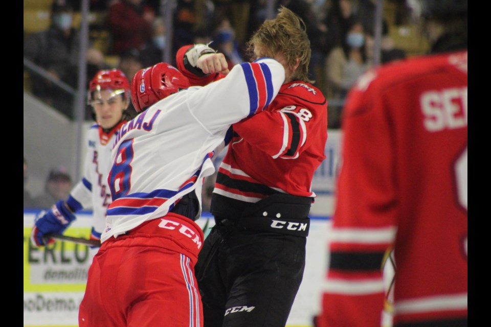 Kitchener's Arber Xhekaj connects with a few haymakers and dropped Owen Sound captain Mark Woolley during a first period fight.