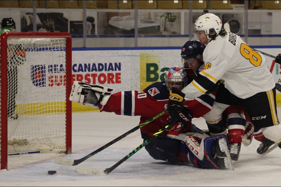Kitchener Rangers goaltender Pavel Cajan sprawls back without a stick to make a save against Sarnia.