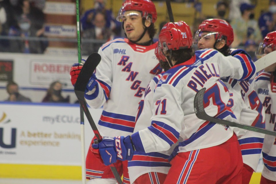 Kitchener Rangers players celebrate a goal during its 2021 home opener.
