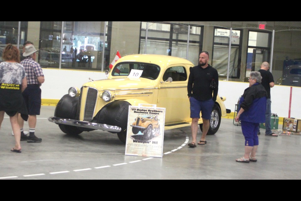 People check out the 1937 Dodge Brothers Business Coupe on display inside the Swamp Cats Arena. Chris McGarry photo. 