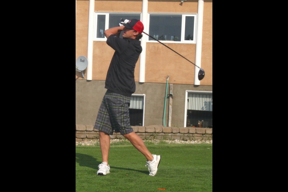 Adrian Bourassa, who played on a team sponsored by Britton’s Independent, looks downrange after teeing off at the beginning of the 2023 Voyageurs Golf Classic. Chris McGarry photo.