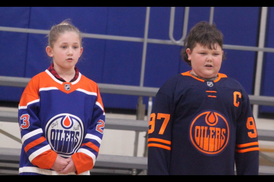 Aliciana Ulliac and Dax Quintal sing Canadian legend Tom Connors' iconic tune 'The Hockey Song' Tuesday afternoon at Vera M. Welsh Elementary School. Chris McGarry photo. 