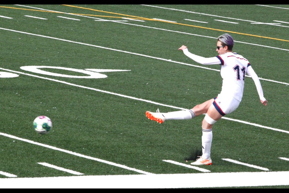 Portage College Voyageurs Ashley Hennefent clears a kick after receiving the ball from the goalkeeper. Chris McGarry photo. 