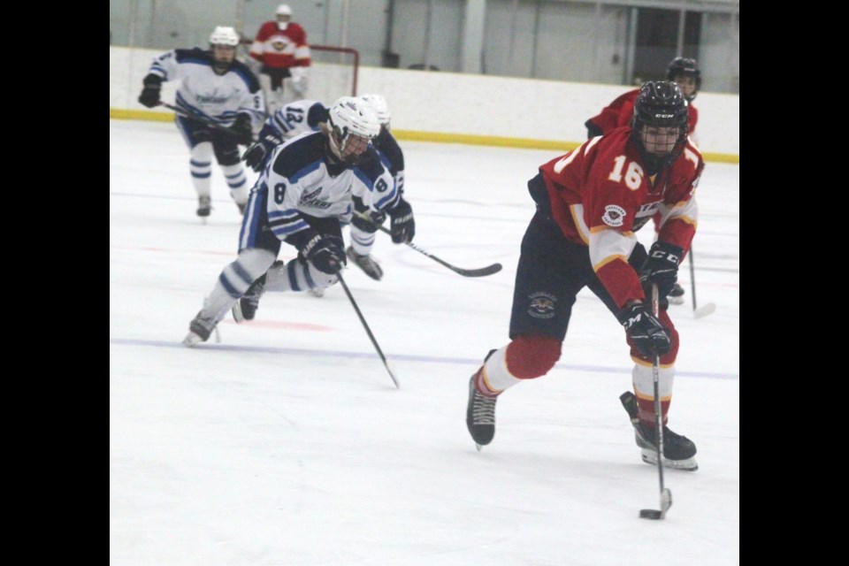 Last Friday, the U18 Lakeland Panthers faced off against the NEBC Yukon Trackers in a fast-paced contest at the Bold Centre. Both the Panthers and the Trackers stayed off the scoreboard until the third period, when they scored two goals each to finish with a 2-2 tie. Panthers forward Atley Chachula is chased by members of the opposing team as he moves towards their net. 