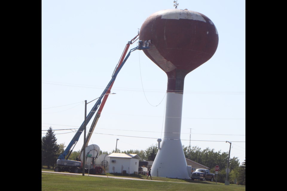 Workers do painting on the side of the water tower on Aug. 28 Chris McGarry photo. 