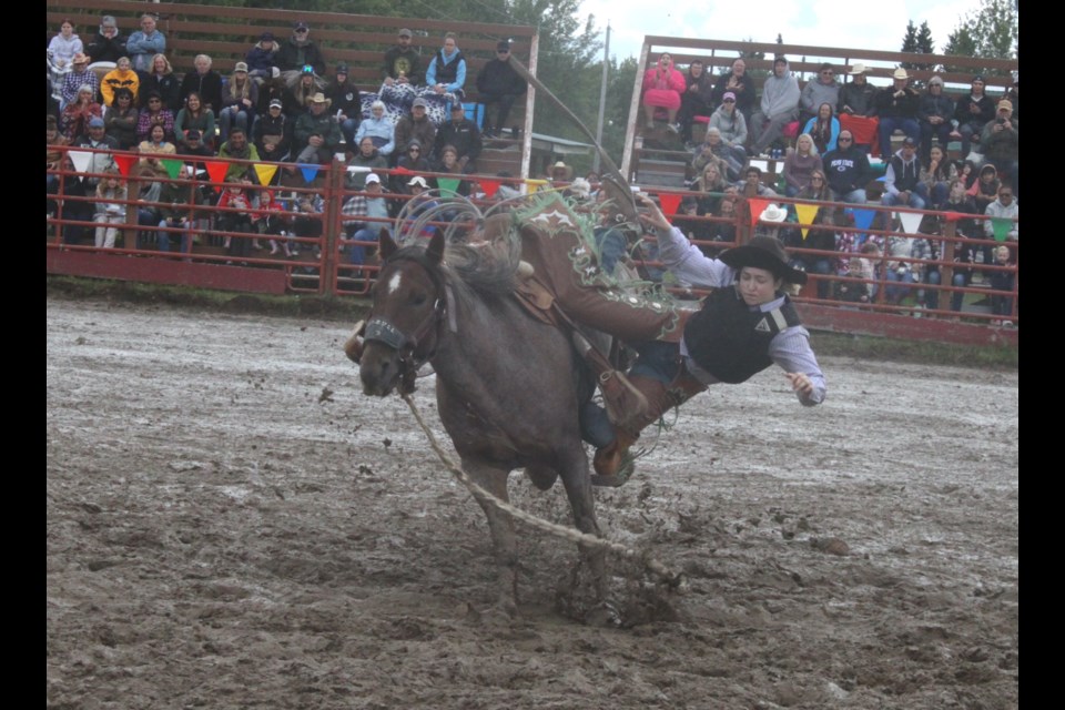 Avery Rose braces herself to be thrown from her mount during the Ladies Bronc riding competition. Chris McGarry photo.