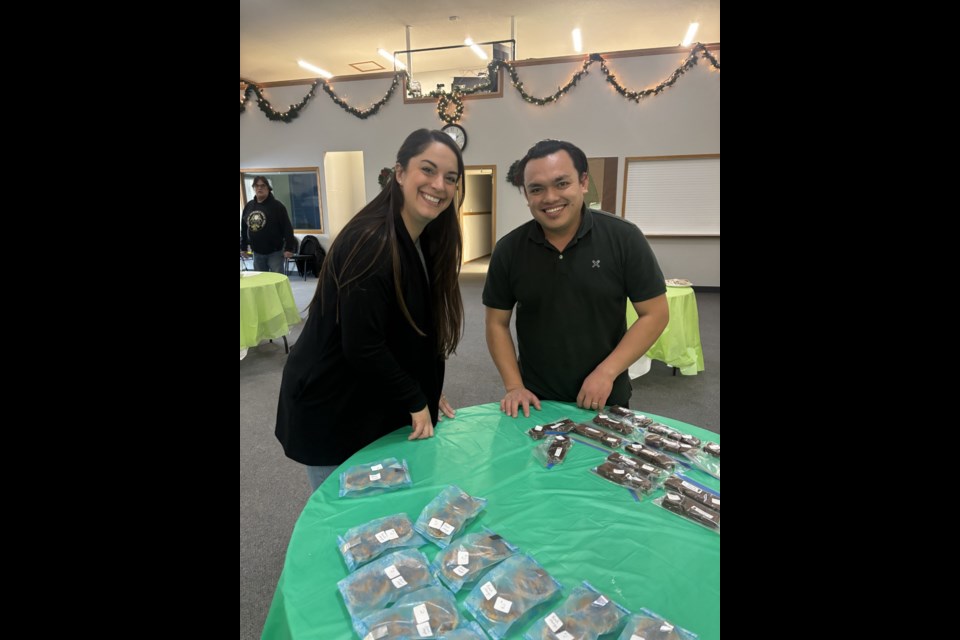 Two eager visitors stopped by early to snag some sweet treats at the bake sale on Dec. 1 held at the community baptism church.