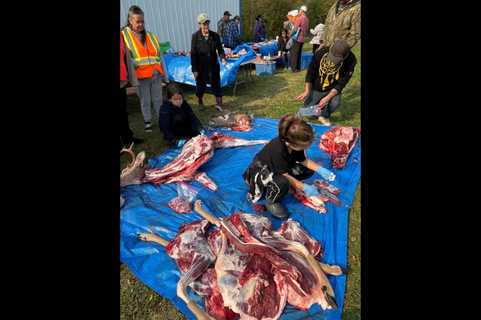 Under the watchful eyes of elders and community members, younger participants in the recent Beaver Lake Cree Nation harvest camp learn valuable traditional skills.