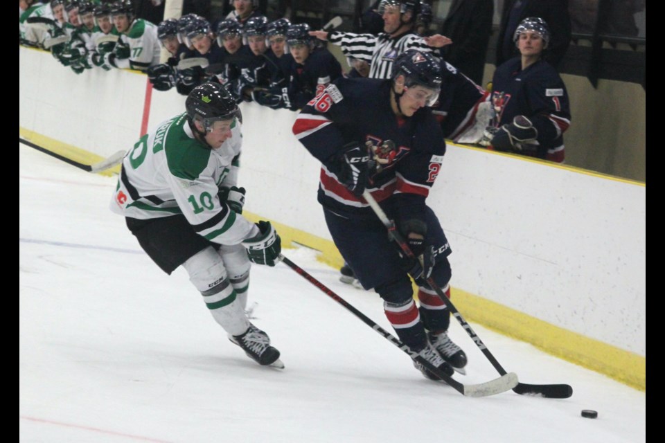 Red Deer Polytechnic Kings defenseman Tanner Sklaruk closes in on Portage College Voyageur Blake Astorino during Friday’s game at the Bold Centre. The Kings came away with a 6-1 victory on Friday and 5-2 Saturday. Astorino scored a goal in each of the games. Chris McGarry photo. 