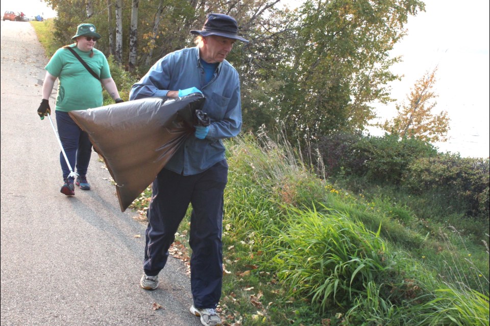 Brian Deheer, president of Healthy Waters Lac La Biche, and Samantha Sampson, education and outreach coordinator for LICA (Lakeland Industry and Community Association) check for garbage along Churchill Drive. Chris McGarry photo. 