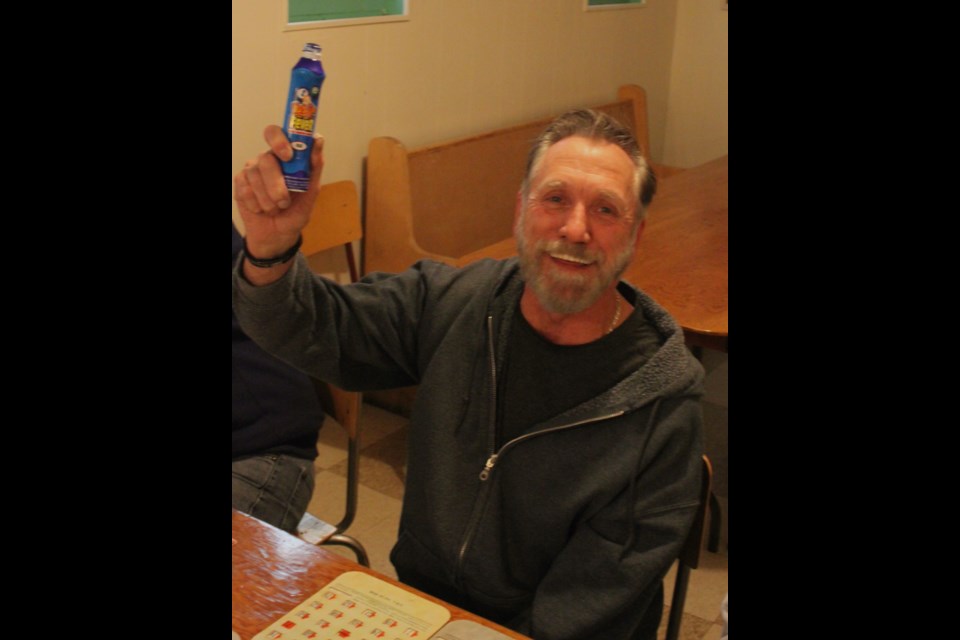 Bruce Snook celebrates as he calls out ‘bingo’ after getting the right numbers. Chris McGarry photo. 