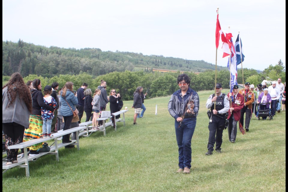 Bryce Delorme, a resident of Buffalo Lake Métis Settlement, plays a traditional drum as he leads the grand entry prior to the start of the National Indigenous People’s Day event that took place at Métis Crossing near Smoky Lake on June 21. Chris McGarry photo.