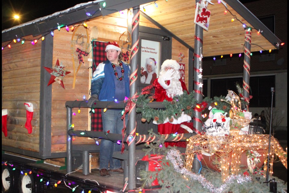 Caleb Theroux, a Grade 12 student at JA Williams (JAWS) High School in Lac La Biche, was chosen as the 2024 Lac La Biche Junior Citizen of the Year. He was introduced to those who attended this year’s Light Up the Night parade by riding through downtown with Santa Claus. Chris McGarry photo. 