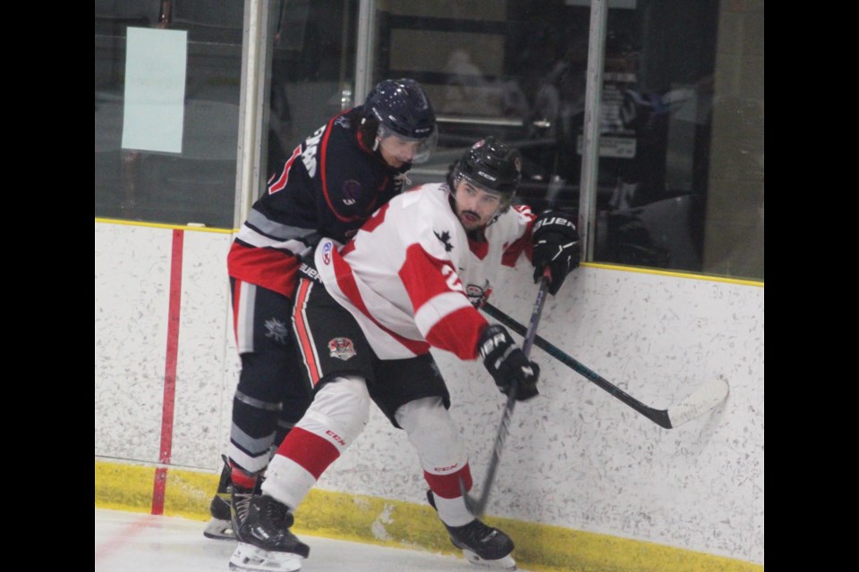 Lac La Biche Lakers forward Carl Horseman clashes with Crowsnest Crush player Hayden Wilson during the March 21 game. Chris McGarry photo.