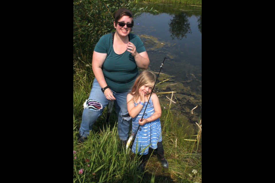 When at first you don’t succeed, patiently wait in the same spot until the fish to start biting. This is exactly what Amelia Pike and her mother, Caroline, did during the Children’s Fish Derby, and were rewarded with this pike fresh from the pond at Alexander Hamilton Park. Chris McGarry photo. 