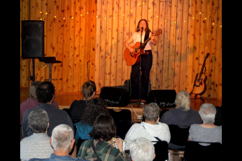 Members of the audience watch Coupland performing on stage. Chris McGarry photo. 