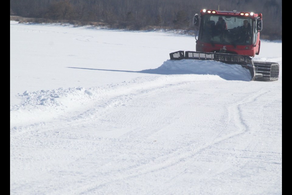 Clearing snow from the runway. Chris McGarry photo. 