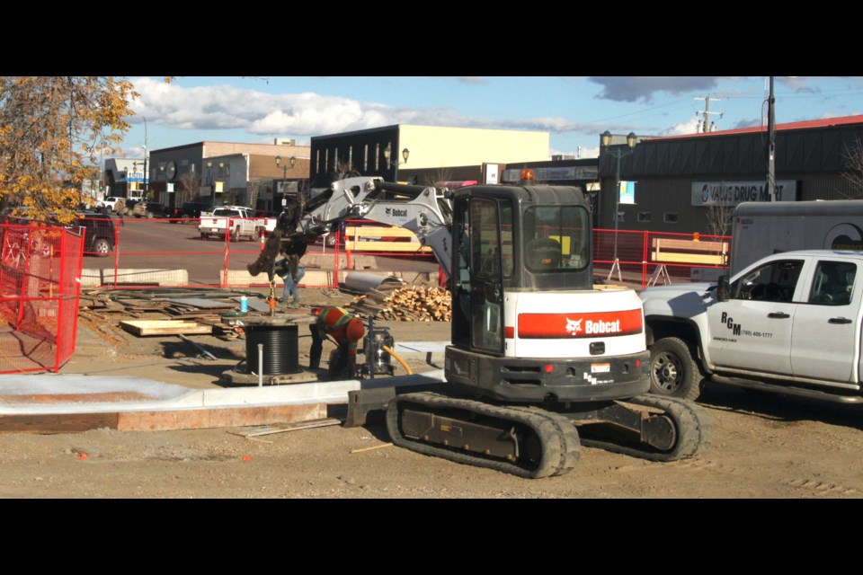 Construction crews were busy this week installing curbs and sidewalks on the phase of the $32.5 million Main Street Revitalization Project from 103 St. to 102 St.  According to Lac La Biche County officials, while completion of the first phase of the makeover of Main Street was initially supposed to wrap up around the end of October, unpredictable weather conditions during the summer means that some of the work won’t be completed until mid-November. Chris McGarry photos 