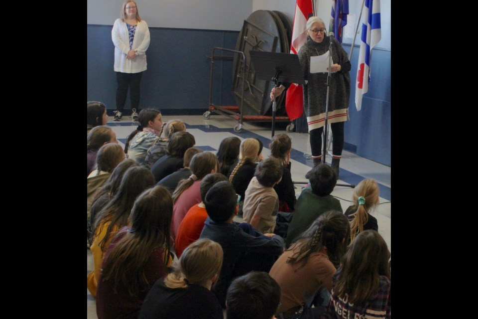 Crystal Plamondon reads a speech on behalf of ACFA president Anita St-Georges. Chris McGarry photo. 