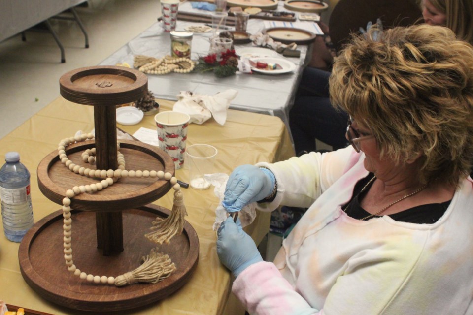 Darlene Macor works on her creation. Chris McGarry photo. 