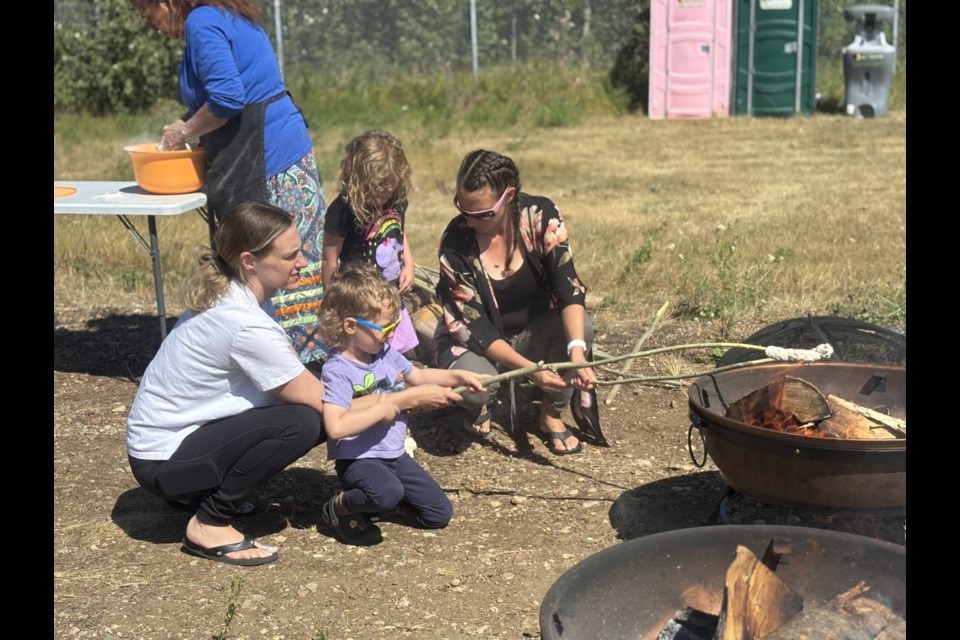People who came to the second annual Day of peace event cooked bannock on a stick.

Photo/ Chantel Downes