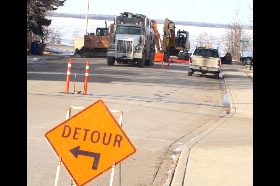 Construction crews were busy on Sunday repairing a broken water main. A section of Churchill Drive and 100 Street was closed off to traffic to allow crews to work. A detour was set up around the area. 

