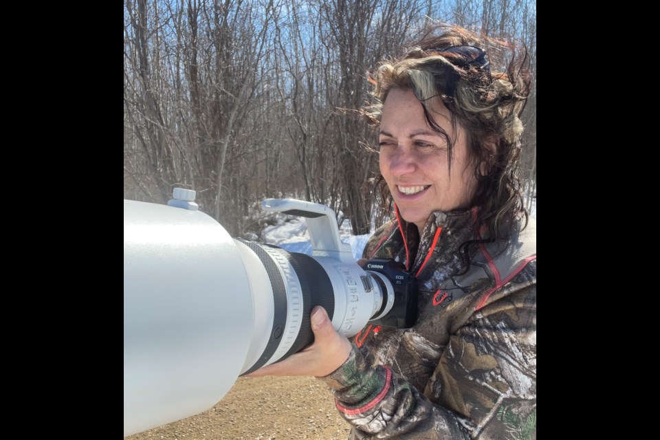 Lac La Biche County wildlife photographer Donna Feledichuk in the boreal forestpreparing for a photo shoot. Submitted photo. 