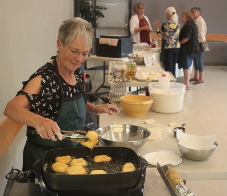 Donna Fabbro participates in a bannock making demonstration during the 2024 Alberta Open Farm Days event at the Lakeland Agricom. Chris McGarry photo. 
