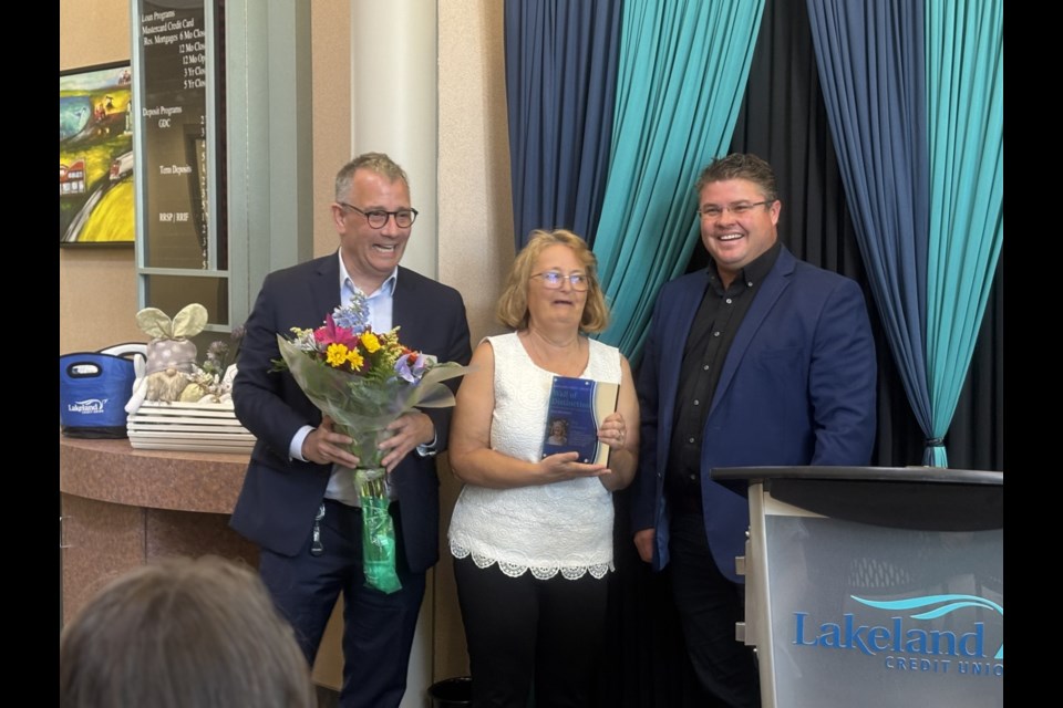 Eva Urlacher receives her award of being on the Lakeland Credit Unions Wall of Distinction during a ceremony at the Cold Lake branch.

(Left) John Peters, CEO of LCU (right)  Kurt Richard, board chair of LCU.

Photo: Chantel Downes