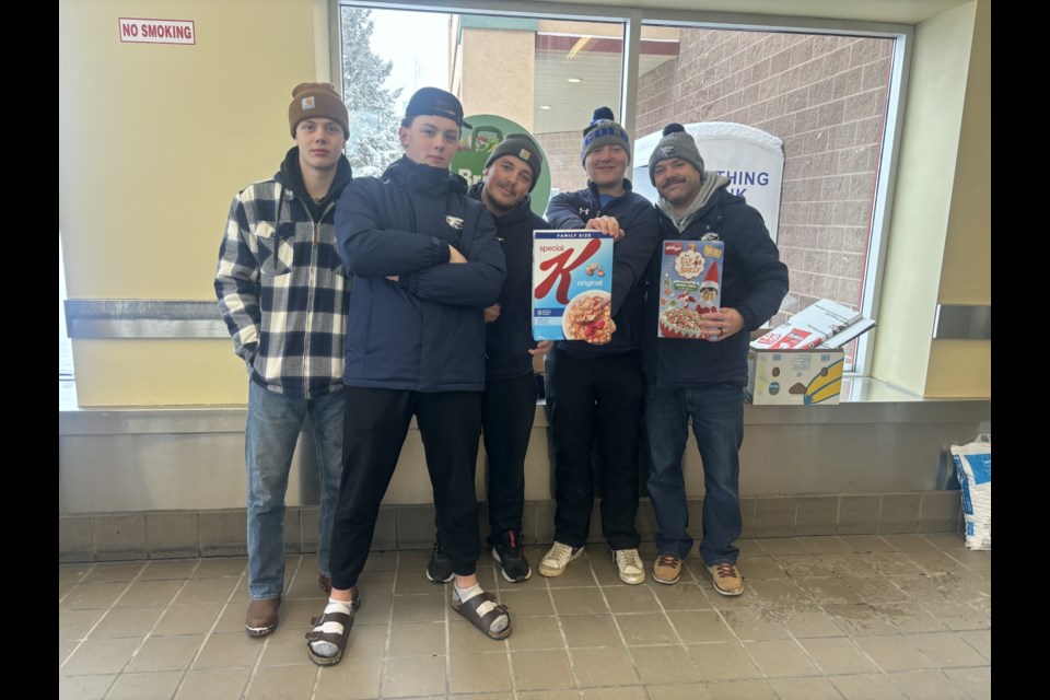 Student volunteers dedicated their time in assisting with collecting donations for the Fill a Bus Christmas Hamper project and loading them into the Cold Lake Food Bank van.