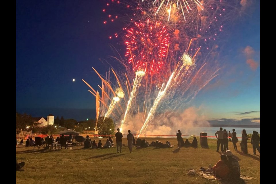 People gathered on the hill in McArthur Park overlooking Lac La Biche Lake take in the vibrant, colourful Canada Day fireworks display that took place on July 1 at 11 p.m. Chris McGarry photo. 