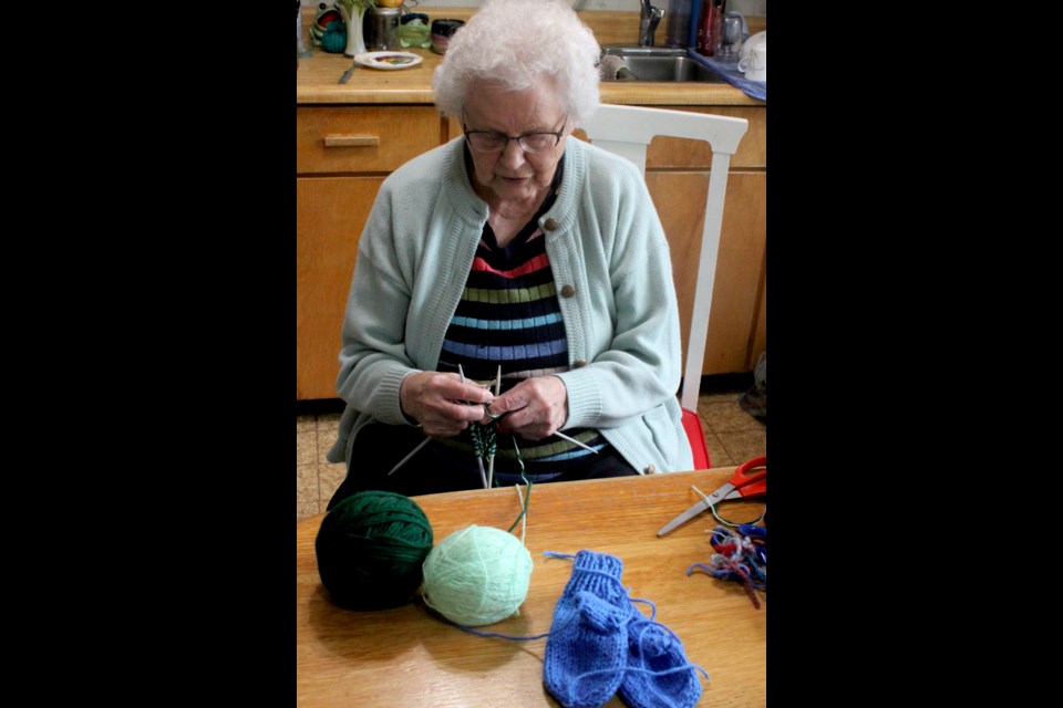 While she isn't as active as she once was, 95-year-old Freda Phillips continues to stay busy and enjoys knitting. Chris McGarry photo. 
