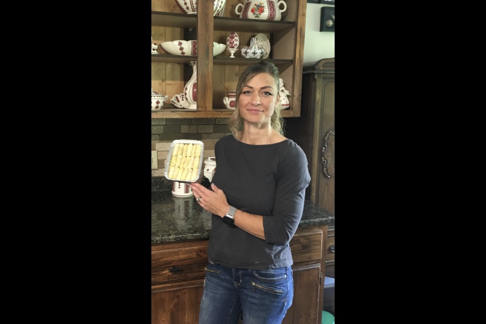 Glenda Summers stands in her kitchen with a pan of sour cabbage rolls she had just rolled. 
Submitted photo. 