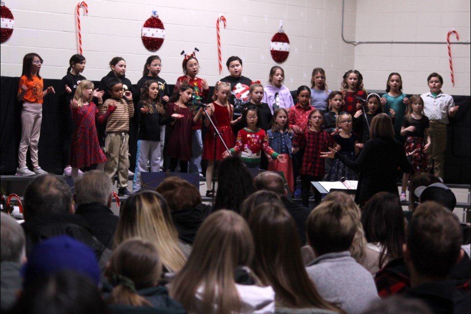 The Vera M. Welsh combined Grade 2 and 3 choir sang 'Snow, Snow, Snow' and 'We Wish You a Swingin' Holiday' at the concert. Chris McGarry photo. 