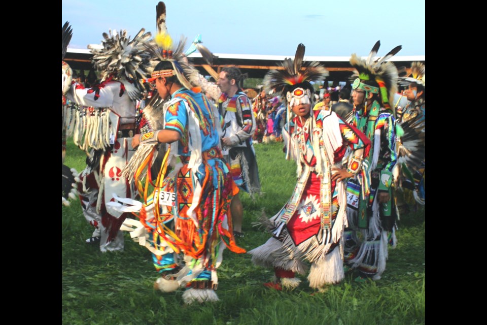 Dancers in Friday night's Grand Entry at teh Beaver Lake Cree Nation Competition Powwow.  The event, which has a modern history of more than 40 years, returned for the weekend after a four-year hiatus.