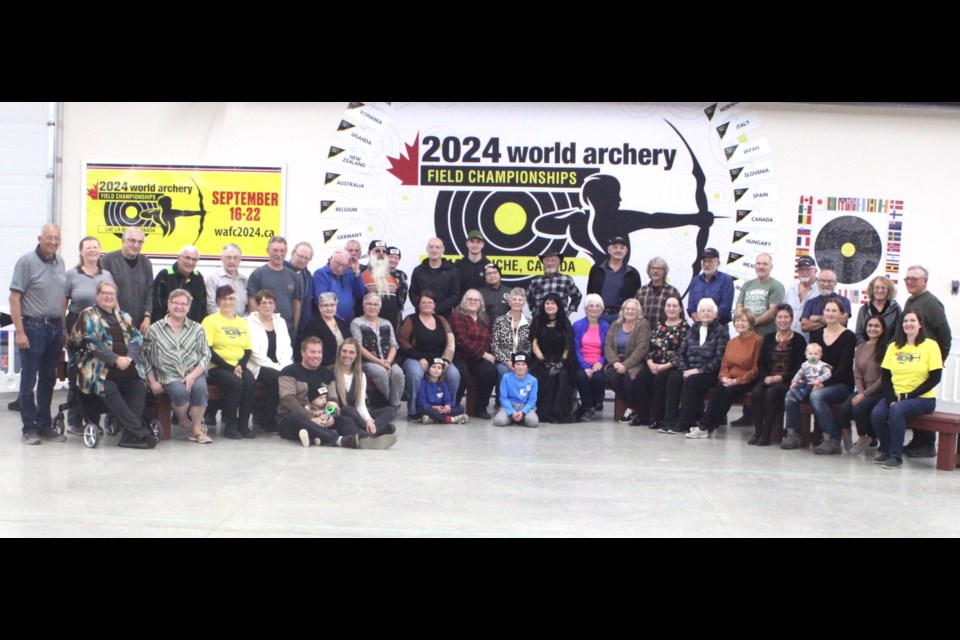  Around half of the 140 volunteers who helped out at the 2024 World Archery Field Championships-which took place in Lac La Biche from Sept. 16-22-gather for a group photo. On the far left is Rene Schaub, president of the Lakeland Archers. Chris McGarry photo. 