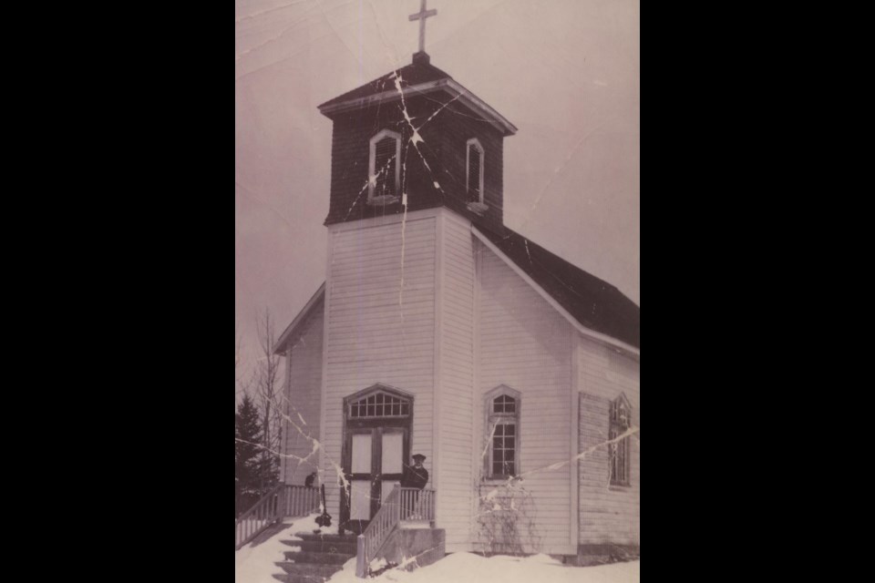 A priest standing on the deck of Holy Redeemer parish in the wintertime. Submitted by Venice-Hylo Heritage and Historical Preservation Society. 