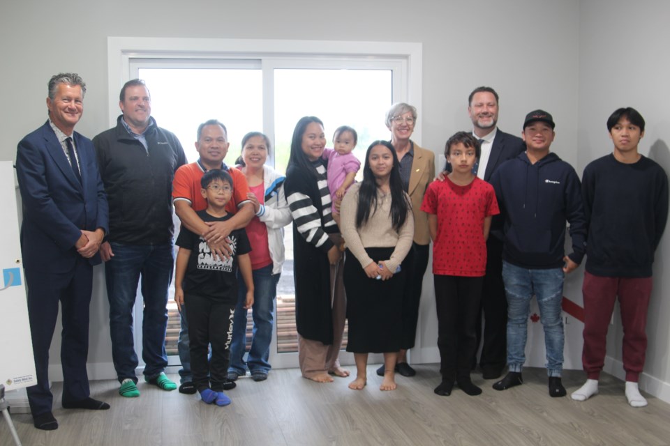 On Sep. 12, Habitat for Humanity marked a joyous occasion as new homeowners received the keys to their homes through Habitat’s affordable homeownership program.

The new homeowners with their families stand aside Mayor Craig Copeland (Far left), Trevor Benoit, president of Value Master Homes, Maricris Mania and her family, Iddela Malinao and her family, then behind them on the far right is Ann-Marie Reddy, President and CEO of Habitat for Humanity Edmonton, and Bonnyville-Cold Lake-St. Paul MLA Scott Cyr.