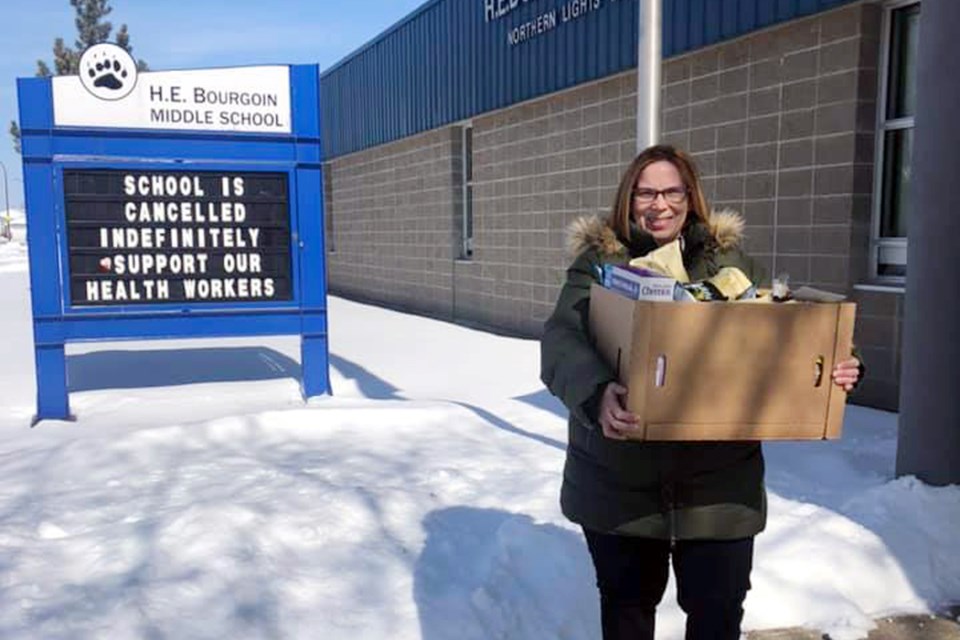 Kelly Murphy, H.E. Bourgoin School teacher and breakfast program coordinator, helped deliver hampers to students. Photo submitted. 