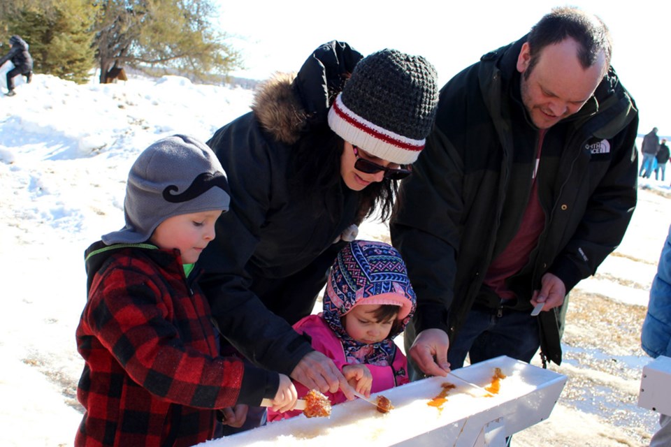 The annual La Cabane á Sucre du Nord, also known as the Northern Sugar Shack, is Saturday, March 14 at Camp St Louis.
(left to right) Six-year-old Spencer, Jenelle, three-year-old Bella, and Dan Drechsel. File photo. 